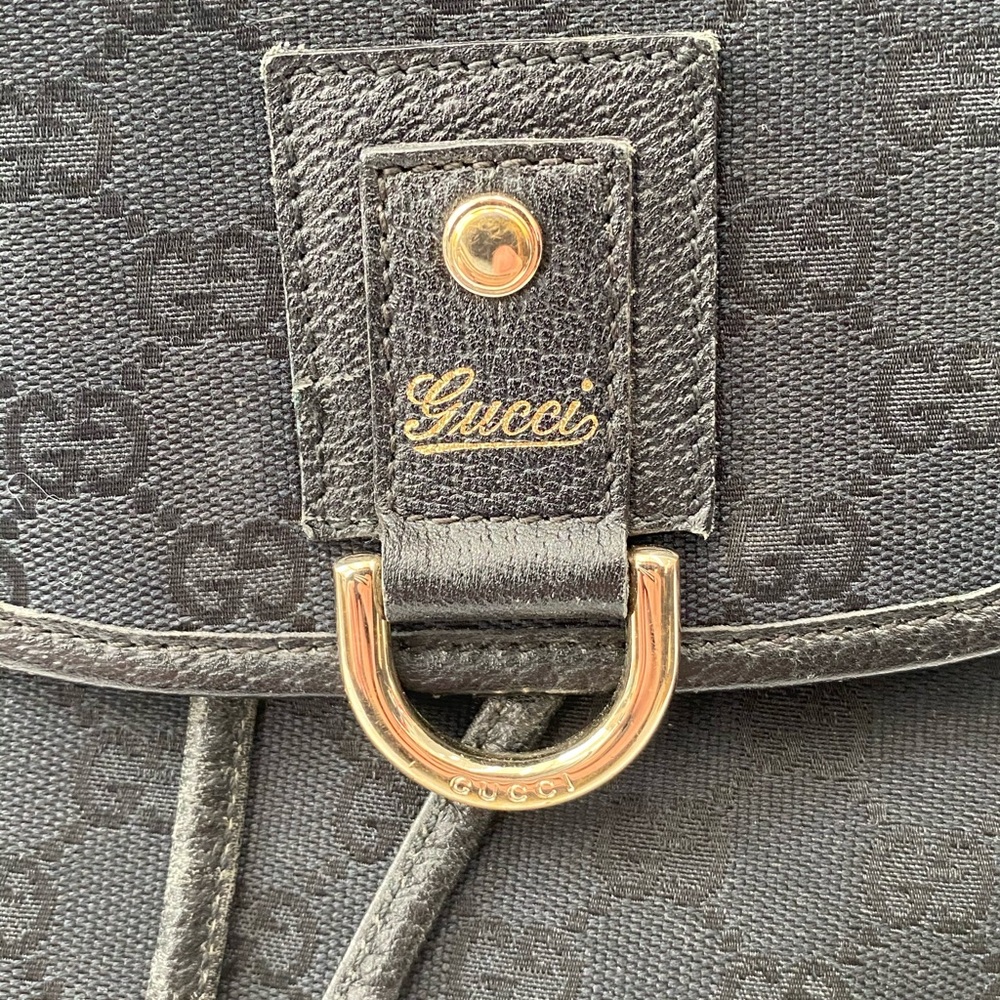 Gucci Black GG Canvas Drawstring Backpack with Gold Accent - Picture 13 of 14